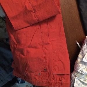 Two pairs of twill pants with elastic sides.